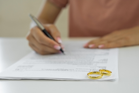 person signing divorce papers